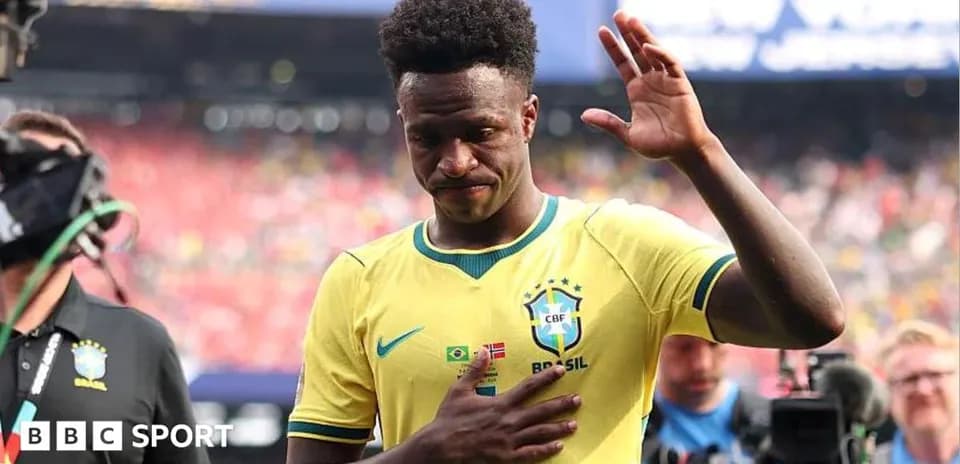 Brazilian player waving during post-match walk