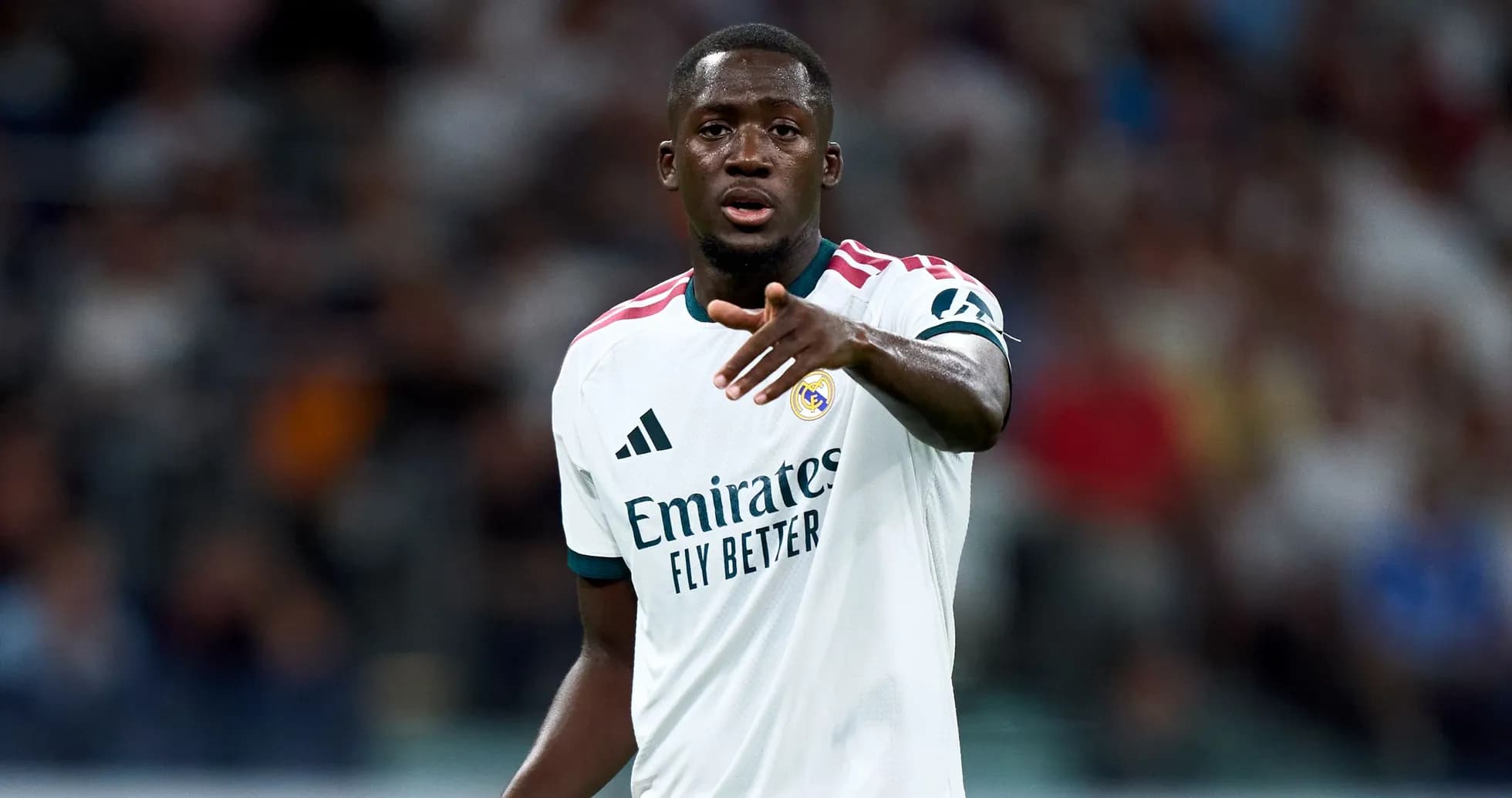 Player gesturing during match in Real Madrid jersey