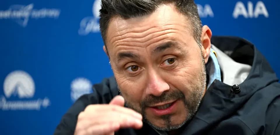 Manager speaking during press conference with gestures