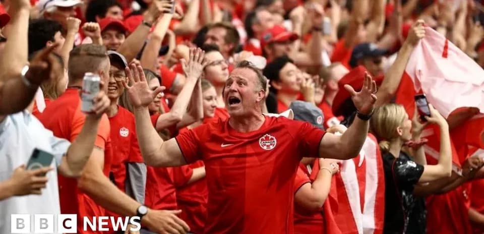 Fans celebrating in red at a sports event