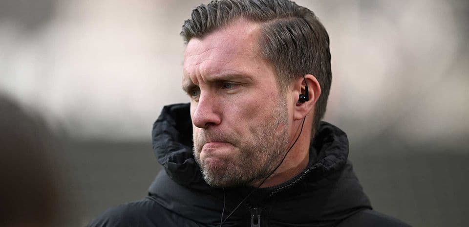 Coach wearing earpiece during training session