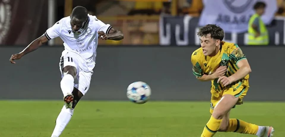Player shooting the ball during UEFA match