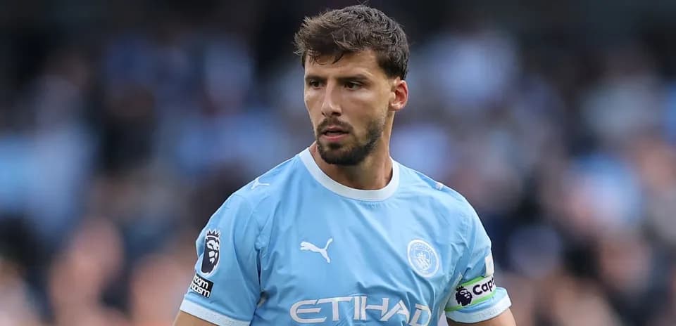 Manchester City player in light blue kit on field