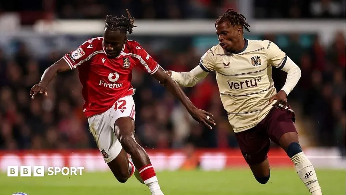 Two players competing for the ball during match