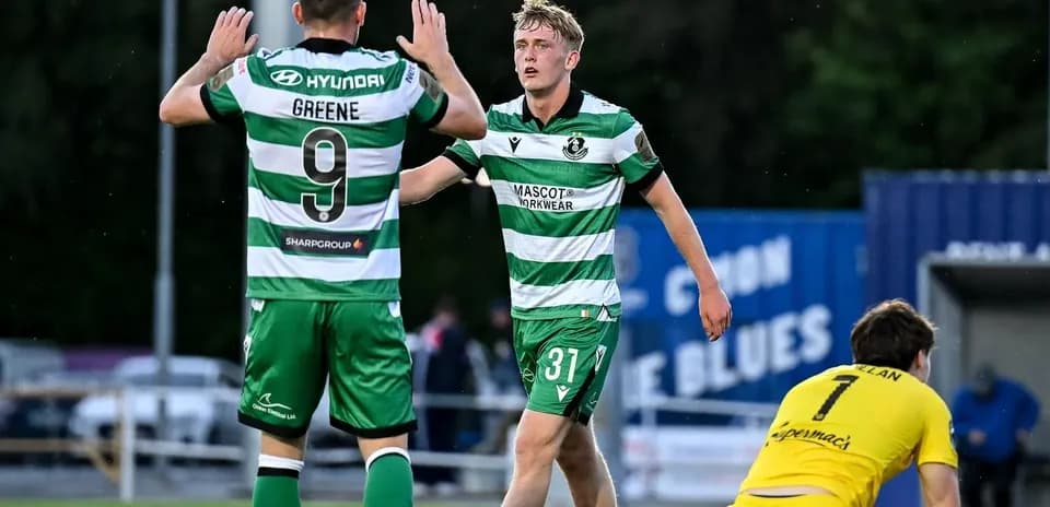 Players celebrating after scoring a goal during match
