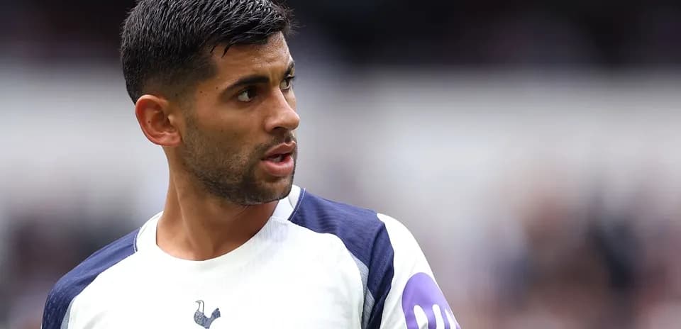 Player in Tottenham kit looking towards the field