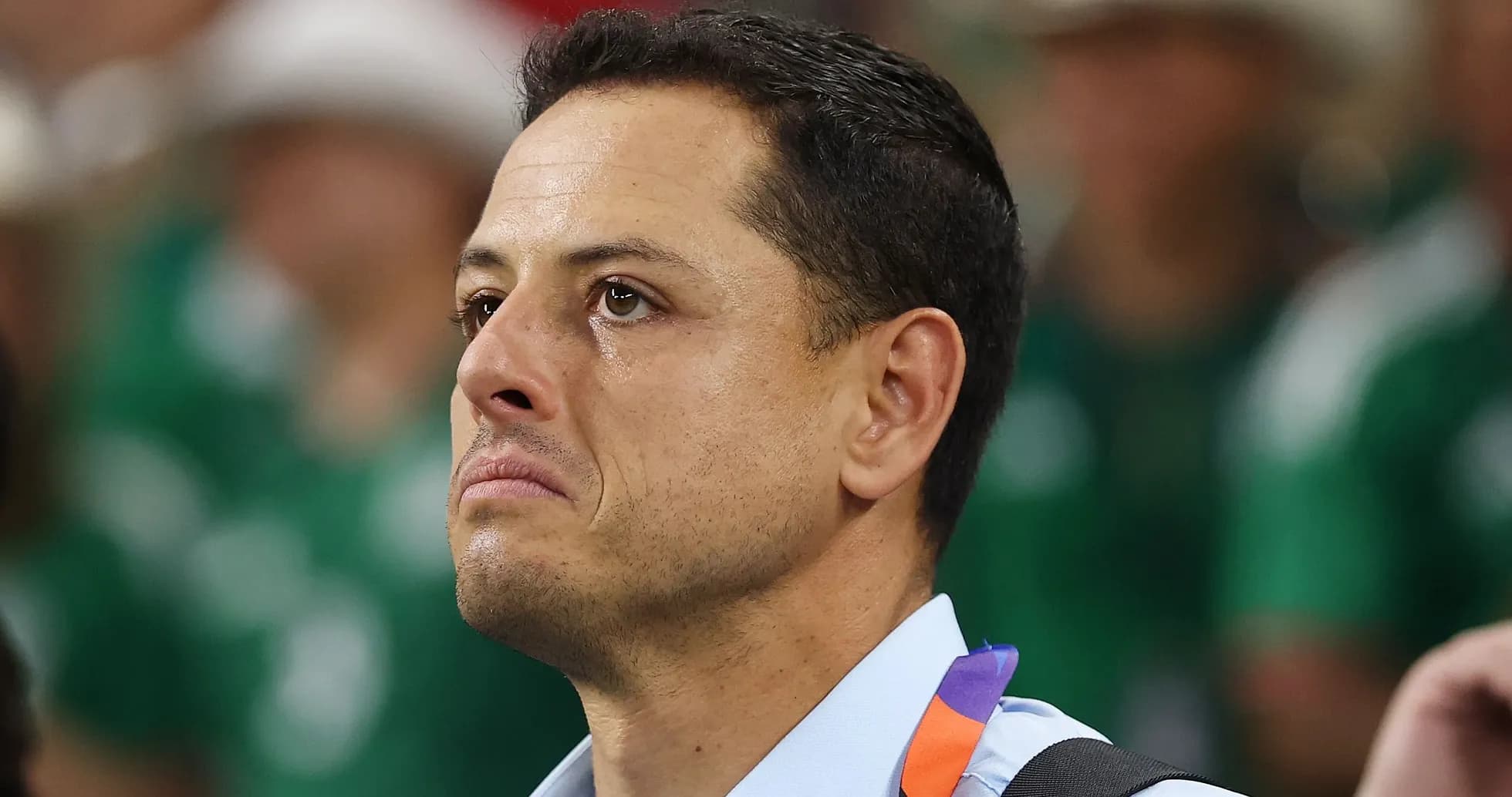 Man with tearful expression at sporting event