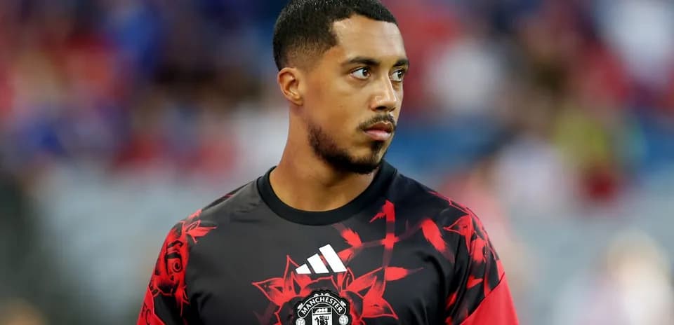 Player in Manchester United warm-up jersey on field