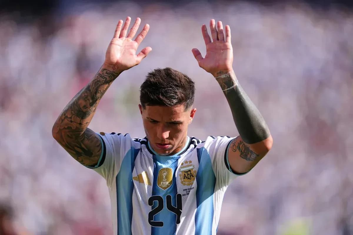 Player raising hands during match in Argentina jersey