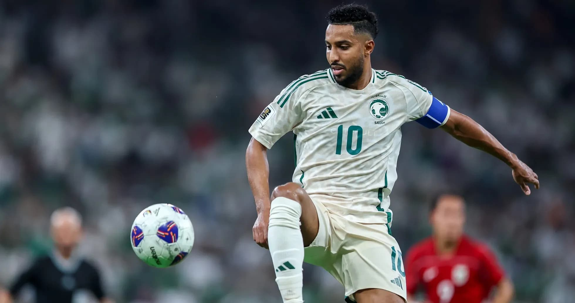 Saudi player controlling the ball during match