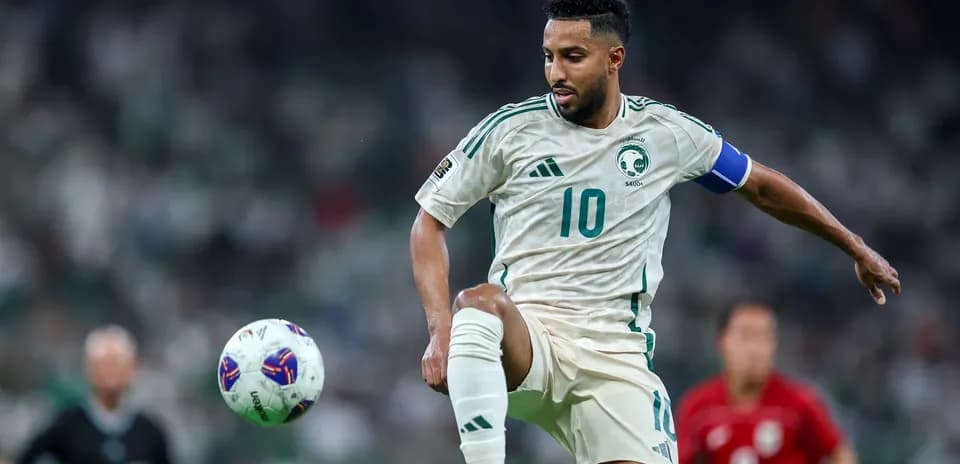 Saudi player controlling the ball during match