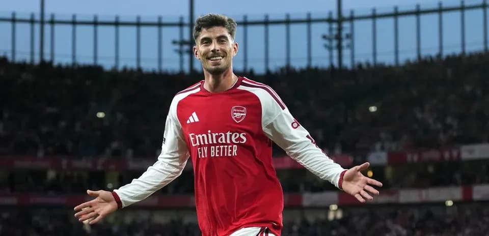 Arsenal player celebrating a goal at stadium