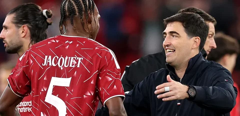 Coach greeting player Jacquet after match