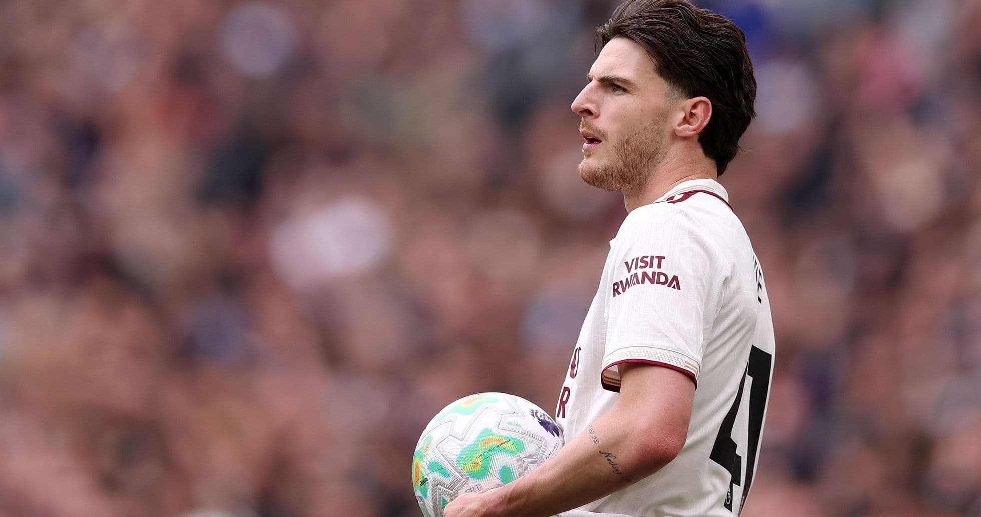 Player holding ball during match on the field