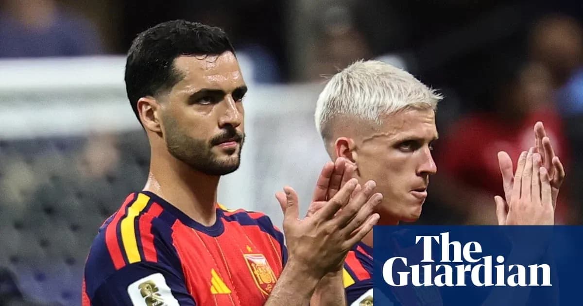 Two Spain players applauding after a match