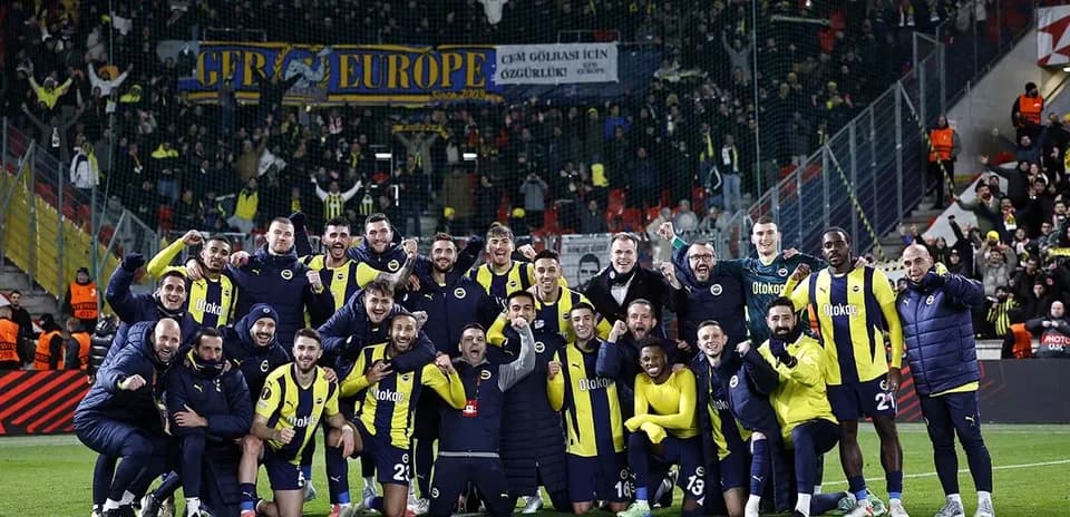 Fenerbahçe team celebrating with fans in stadium