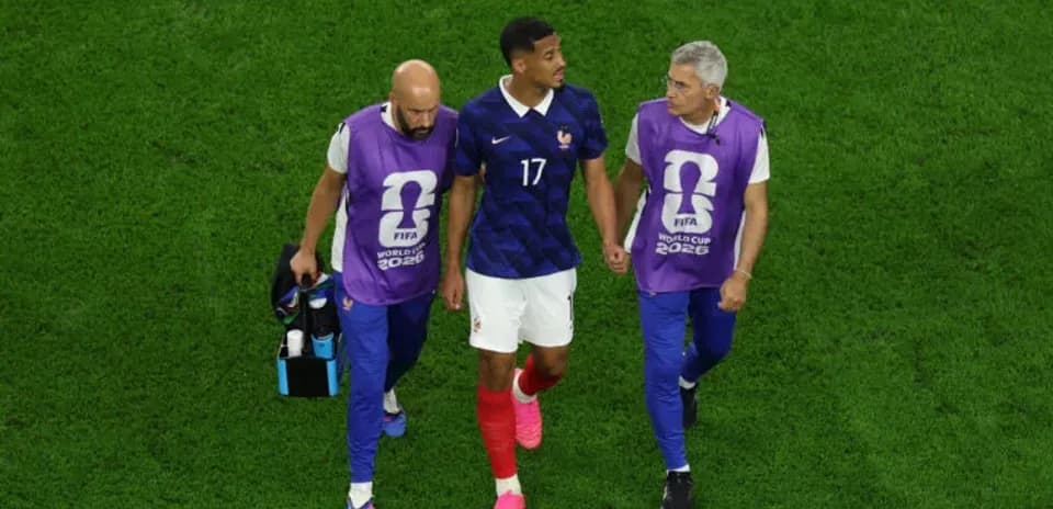 Player assisted off the field by team staff