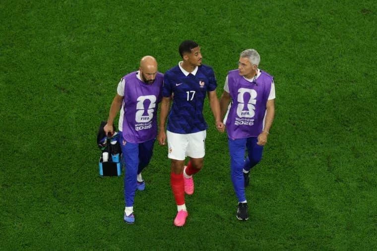Player assisted off the field by team staff