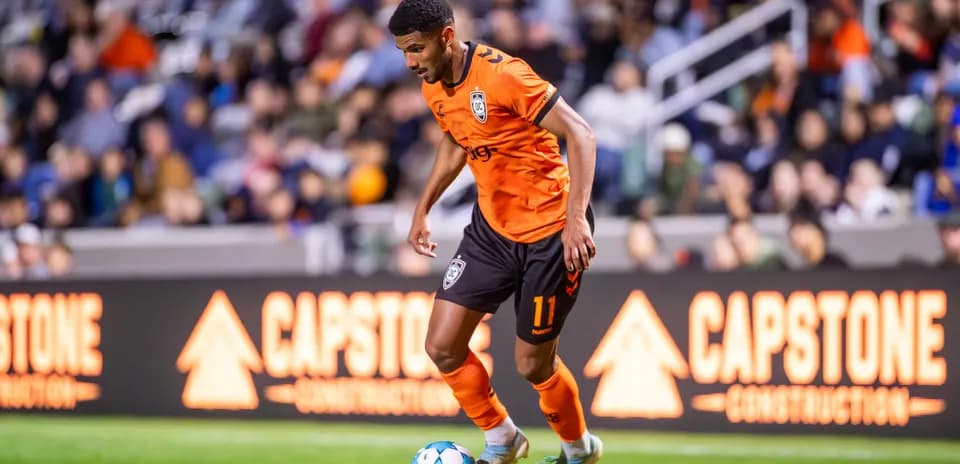 Player dribbling ball during match