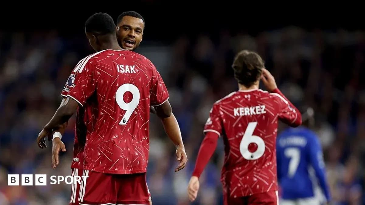 Players celebrating in red jerseys during match