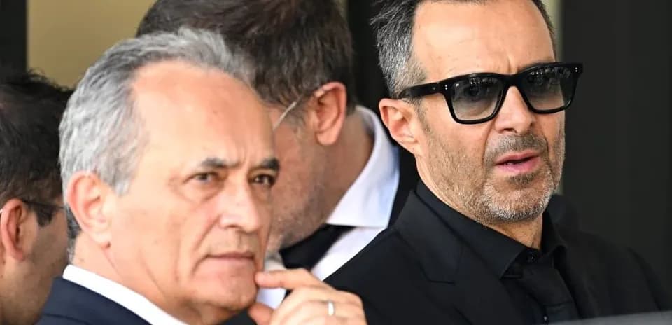 Two men in formal attire at an event