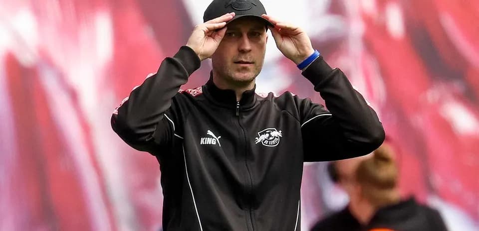 Coach adjusting cap during match preparation
