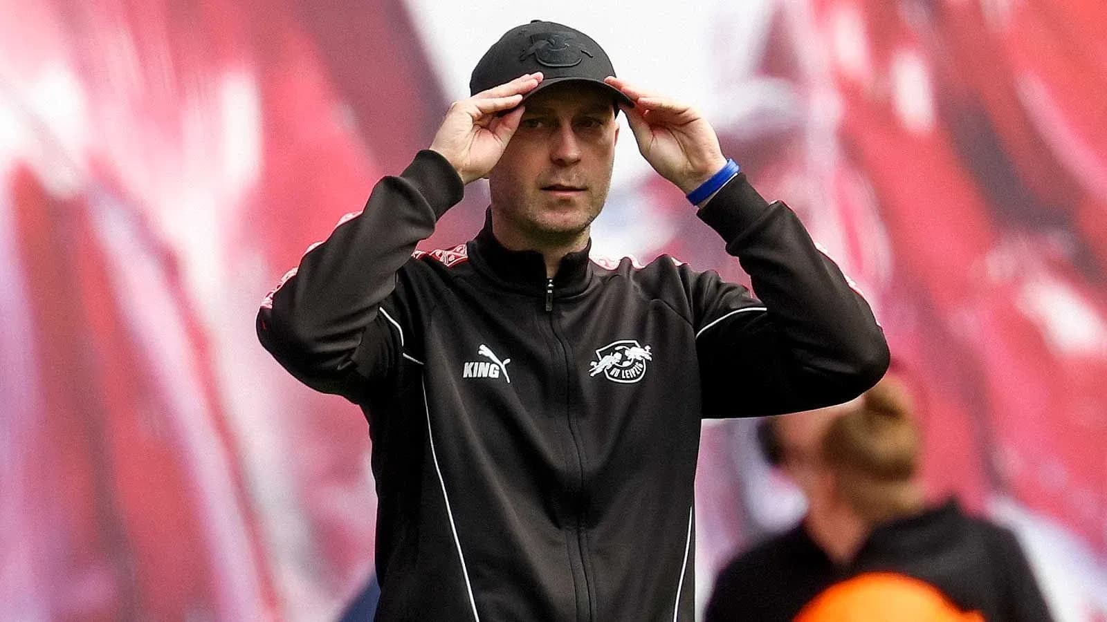 Coach adjusting cap during match preparation