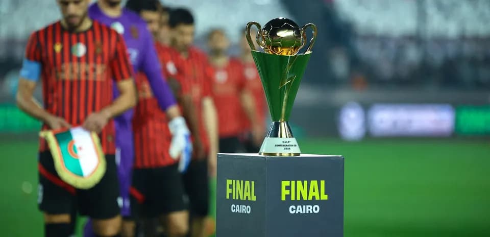 Players walking past trophy before final match