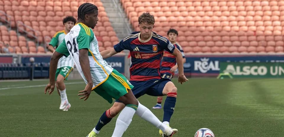 Real Monarchs player tackling Portland Timbers II player