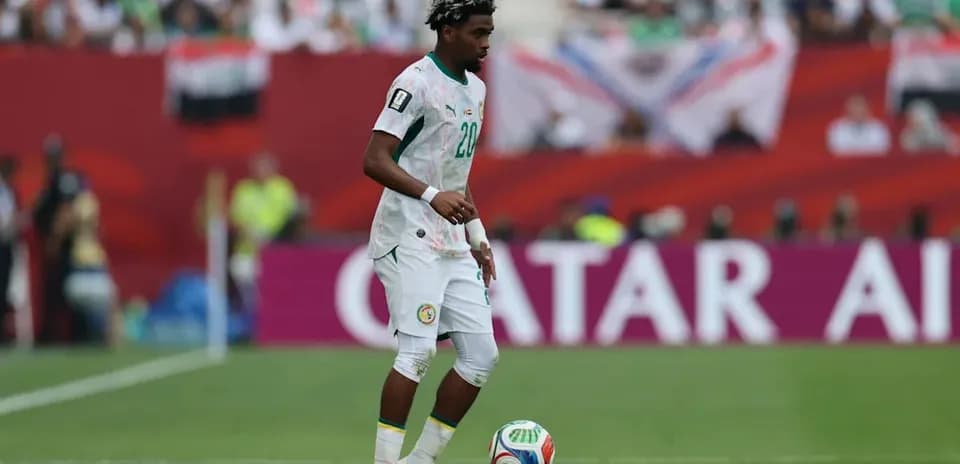 Player dribbling the ball on the field