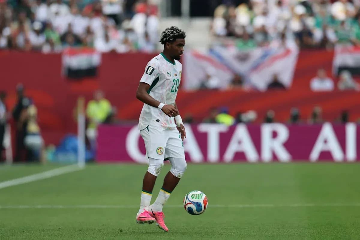 Player dribbling the ball on the field
