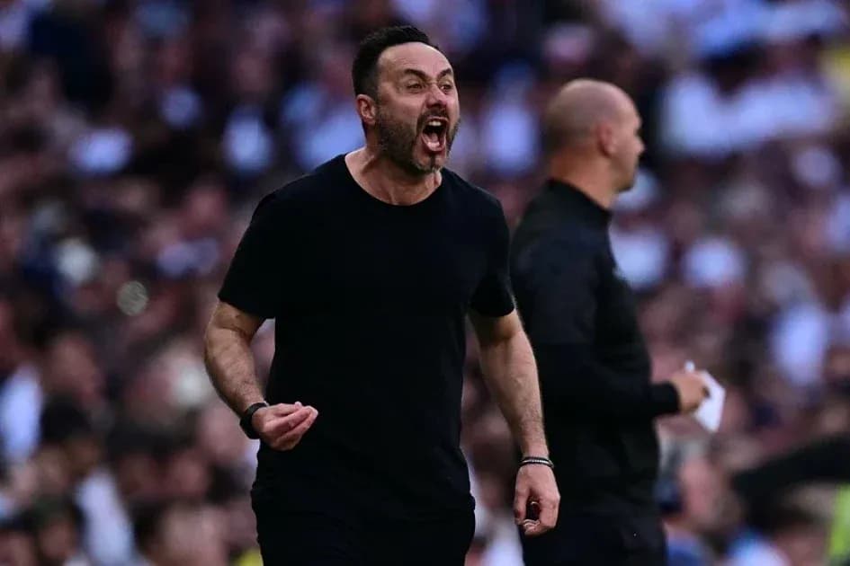 Coach celebrating passionately on the sidelines