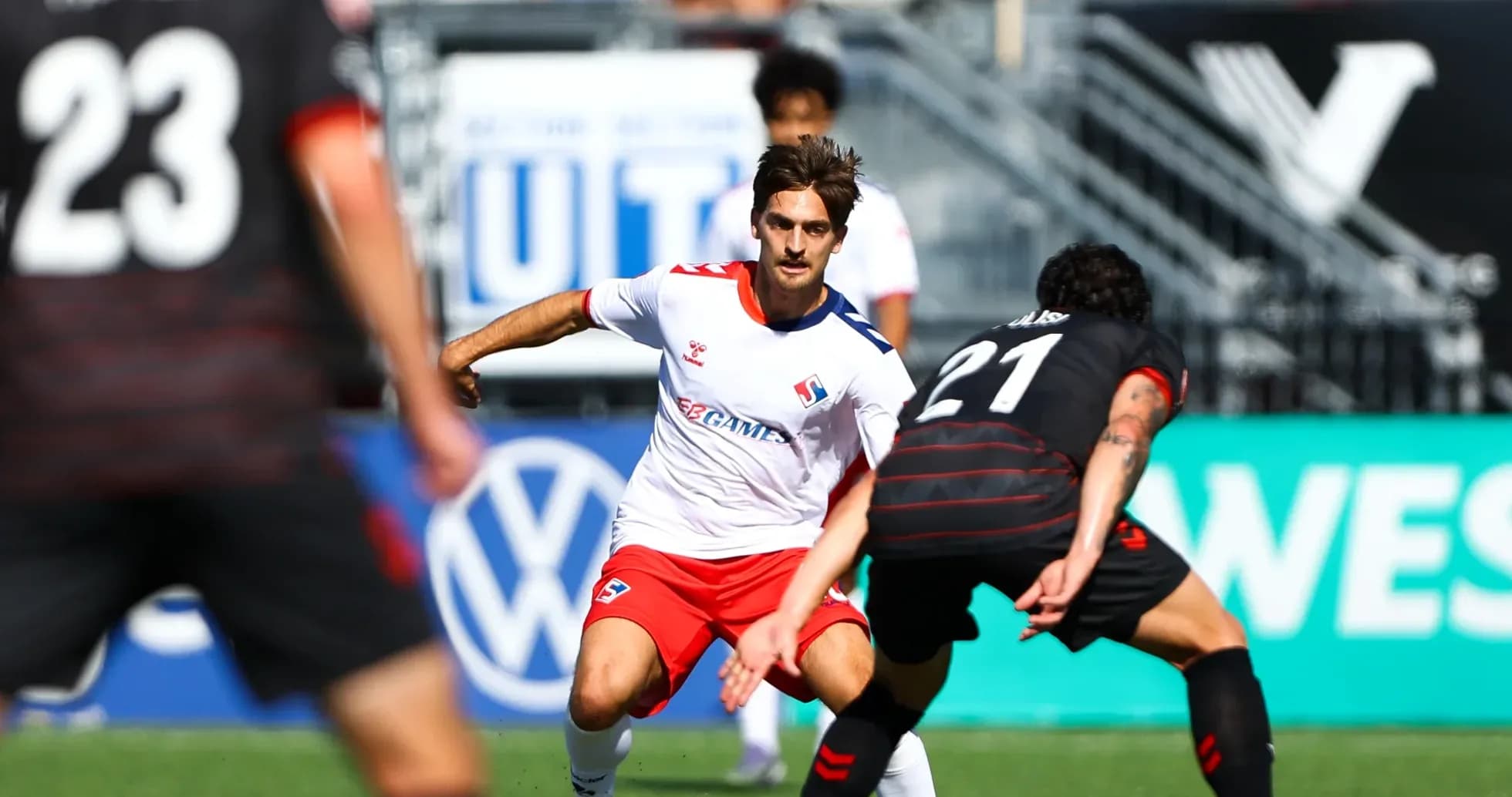 Vancouver FC player dribbling past opponent