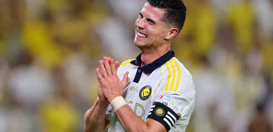 Player celebrating with hands together on field
