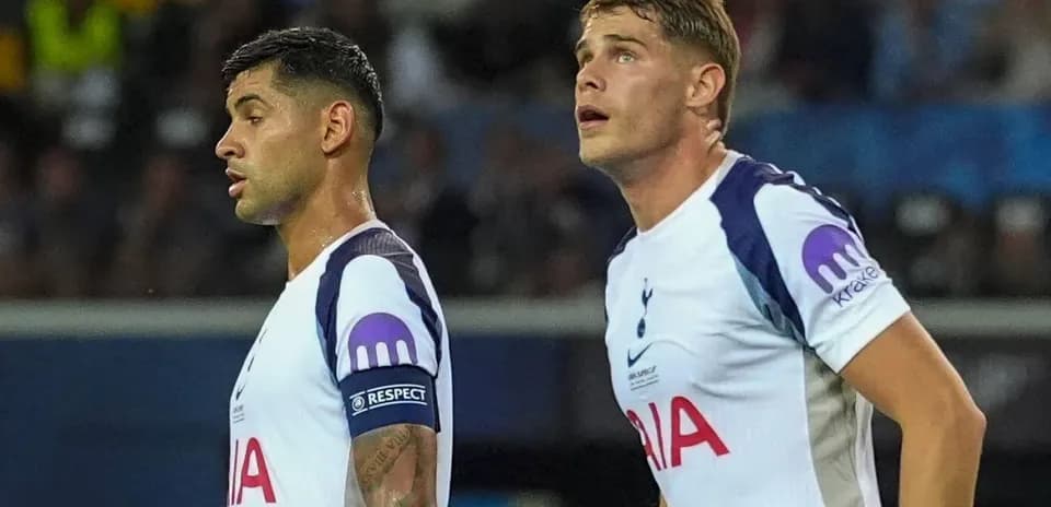 Two Tottenham players looking towards the field