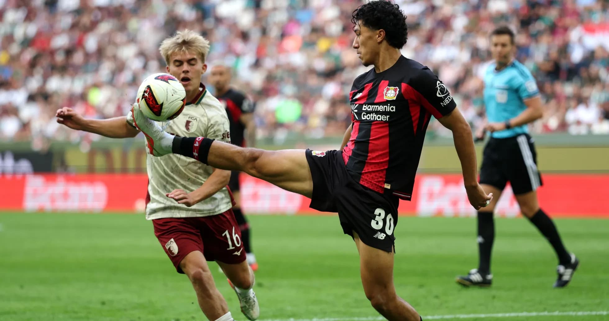 Player from Bayer Leverkusen kicking the ball