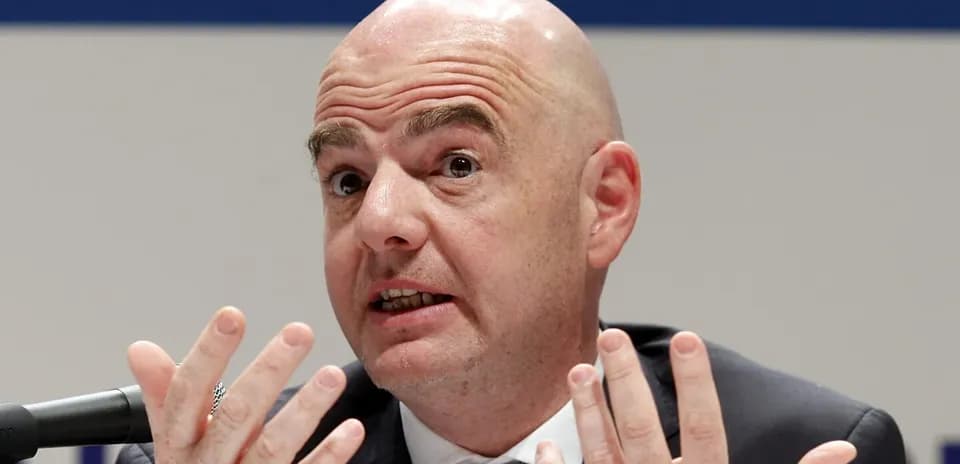 Man gesturing while speaking at press conference
