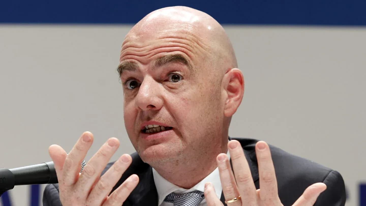 Man gesturing while speaking at press conference