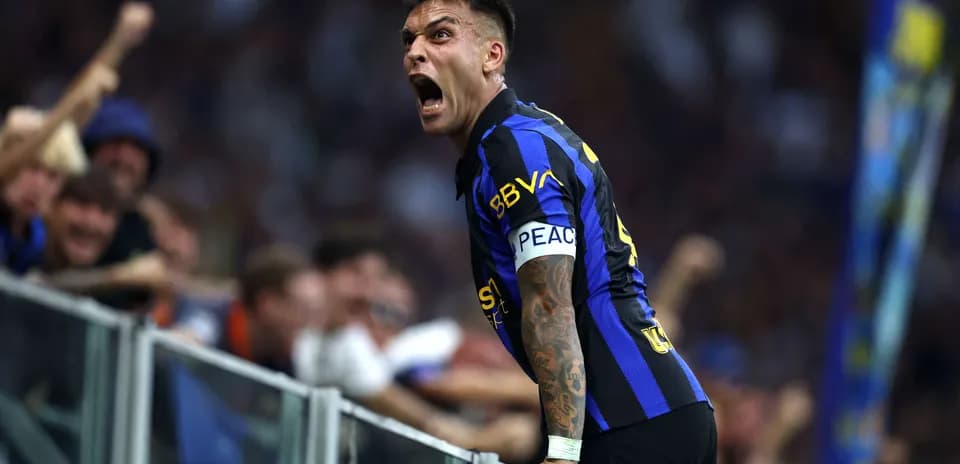 Lautaro Martinez celebrating with fans during match