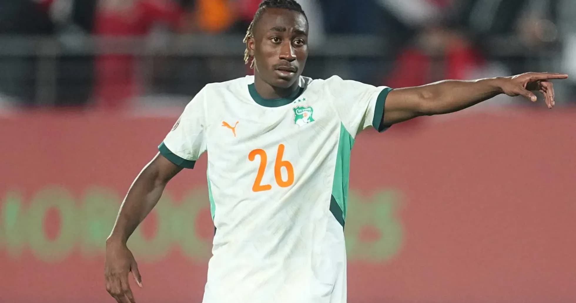 Ivorian player gesturing during a football match
