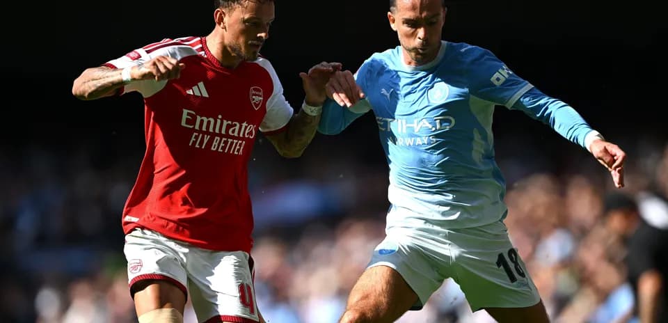 Two players competing for the ball during match