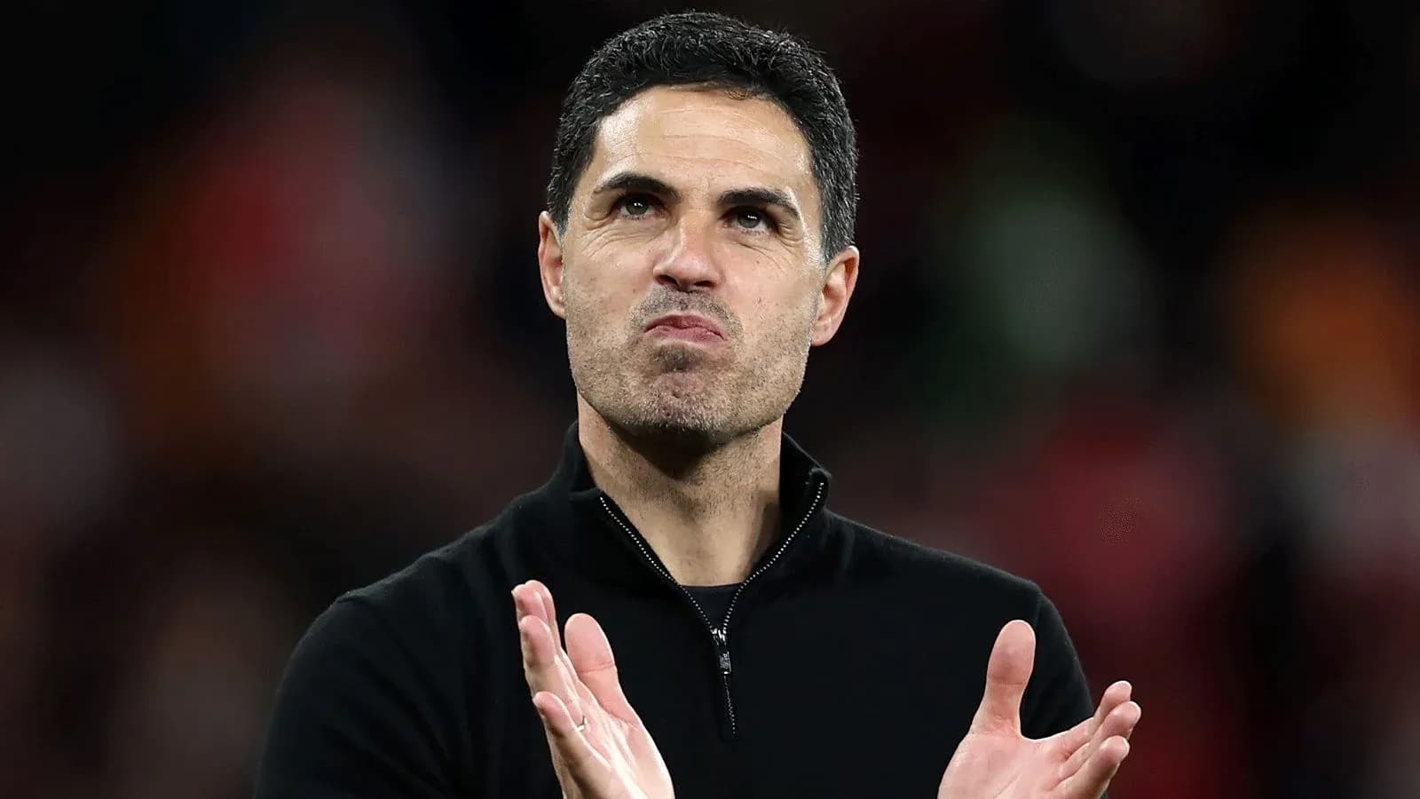 Coach applauding during a match or event