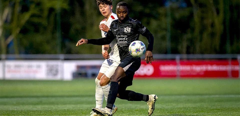 Player kicking ball during Monheim vs Germania Ratingen match