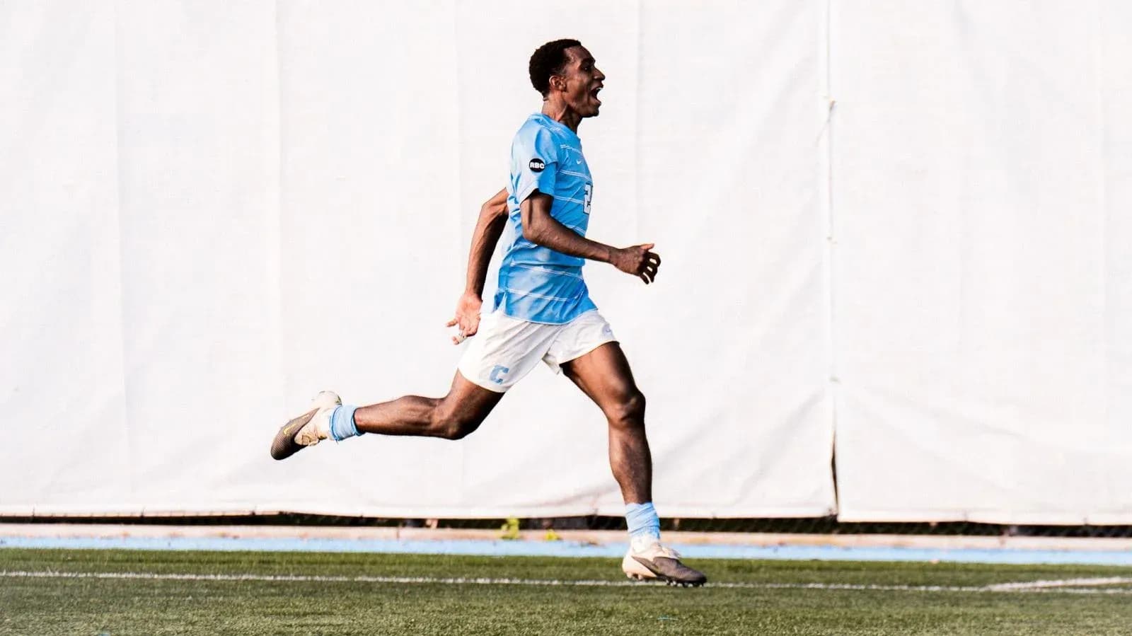 Player celebrating while running on the field