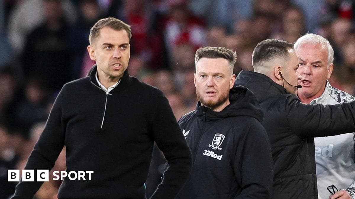 Coaches discussing during a tense moment on the sidelines