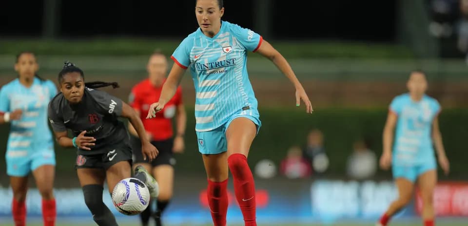 Player chasing the ball during Bay FC match