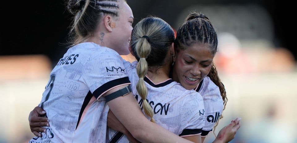 Players celebrating after scoring a goal