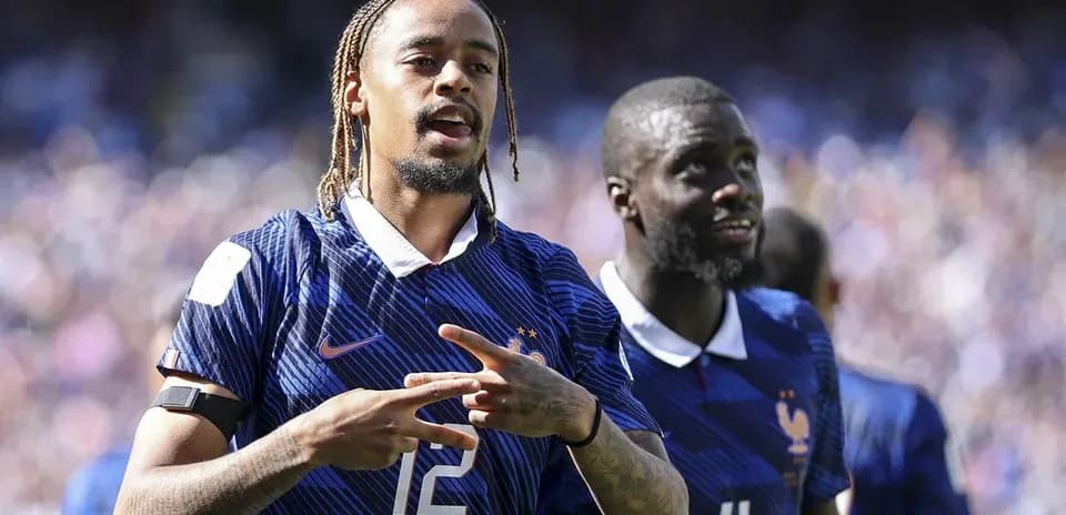 Two France players celebrating during a match