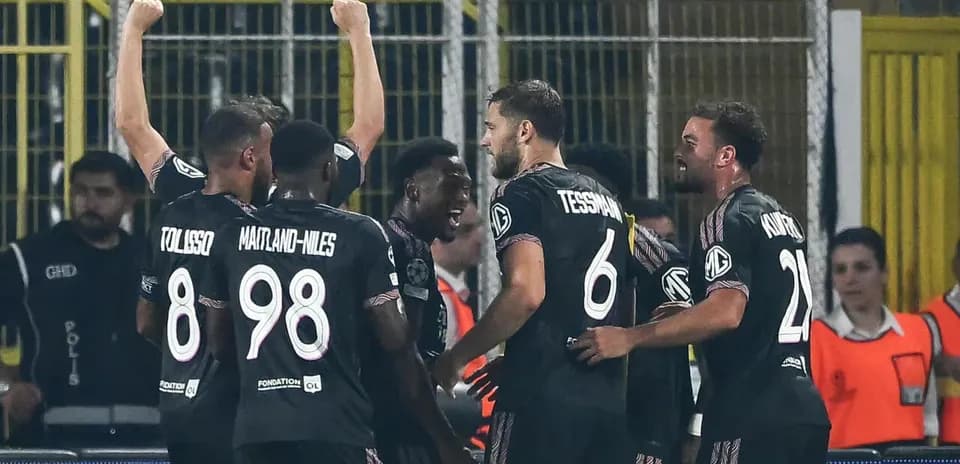 Players celebrating a goal during UEFA match