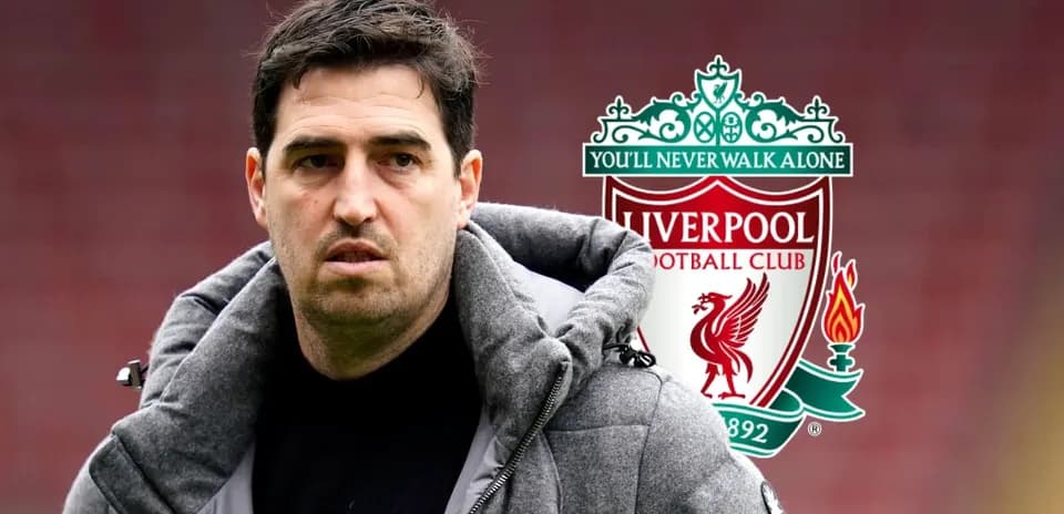 Person in jacket with Liverpool FC logo background